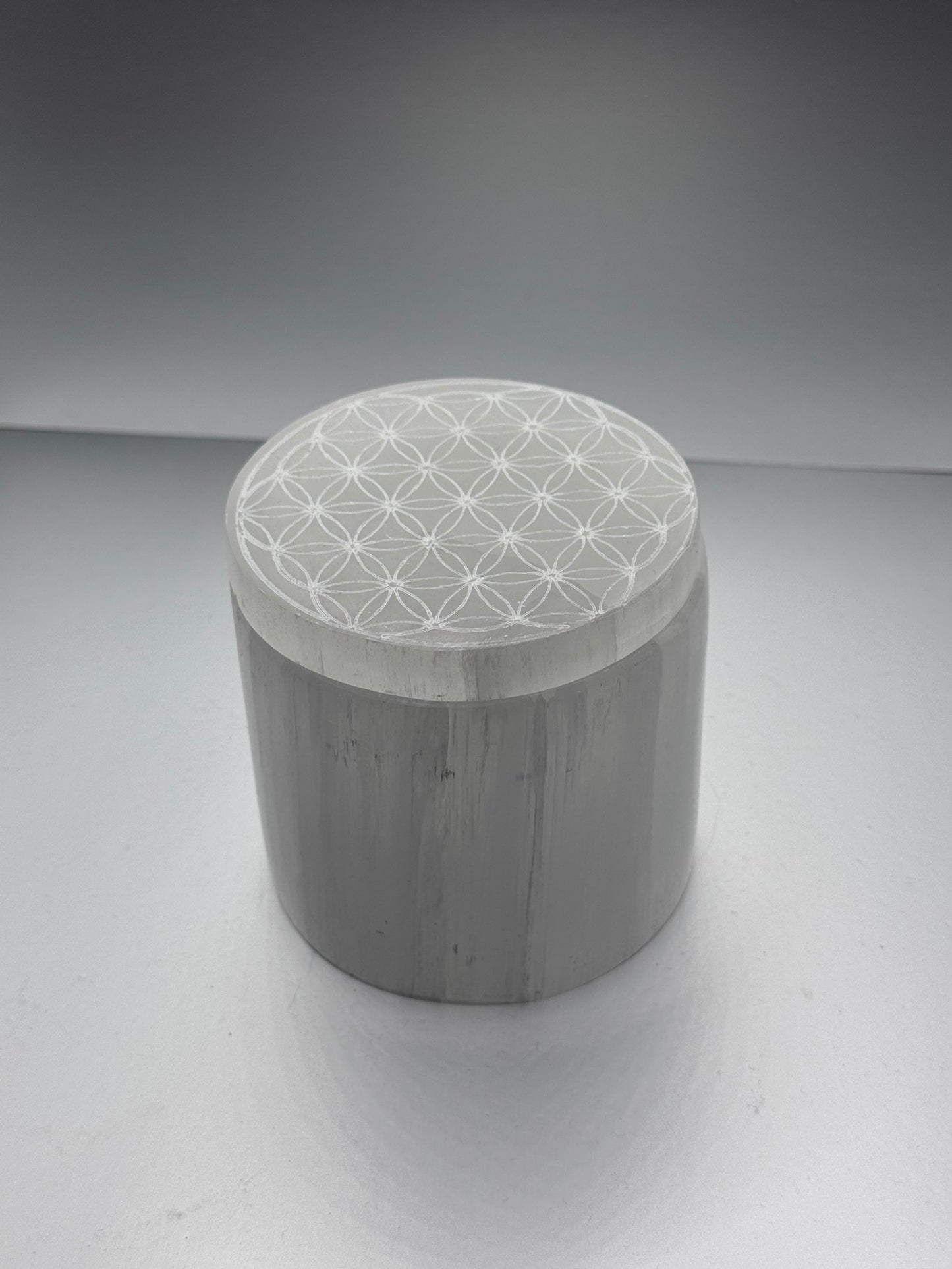 Selenite polished engraved jar with lid.